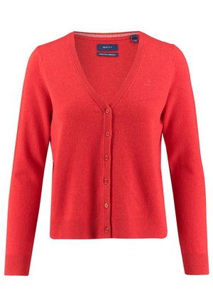 Czerwony kardigan na guziki z dekoltem w serek, wykonany z bardzo drobnej wełny jagnięcej, z długimi rękawami oraz ściągaczami przy mankietach i na dole.