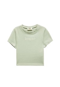 Lys grøn kortærmet bomulds T-shirt med rund halsudskæring, prydet med den broderede tekst "Inspire" på forsiden. Simpelt design.