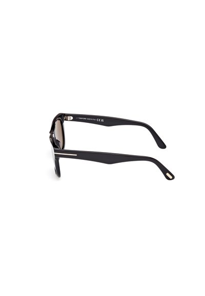 Occhiali da sole neri con un design elegante, bracci angolari, lenti di colore marrone e dettagli dorati. Marchio "Tom Ford" sulla parte interna delle astine.