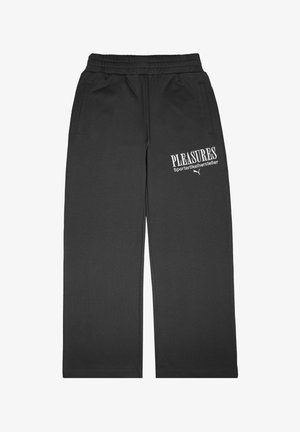 Graue Sweatpants mit lockerem Schnitt, ausgestattet mit einem elastischen Bund, seitlichen Taschen und weißem Drucktext auf der Vorderseite. Weiches Material, gerippte Textur.