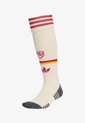 Chaussette de sport blanche montant jusqu'au genou avec des rayures rouges et jaunes, logo Adidas rouge, initiales "CR" en rouge, et zones renforcées grises aux orteils et au talon.