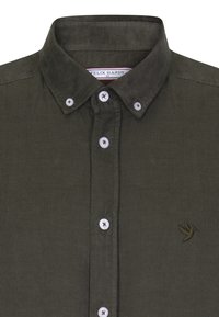 Olivgrünes Cordhemd mit Button-Down-Kragen, weißen Knöpfen und einem kleinen gestickten Vogel-Logo auf der linken Seite.