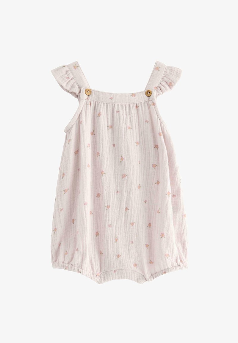 Salopette in mussola rosa chiaro con spalline arricciate, bottoni in legno e motivi floreali sparsi. Texture morbida e aperture elastiche per le gambe.