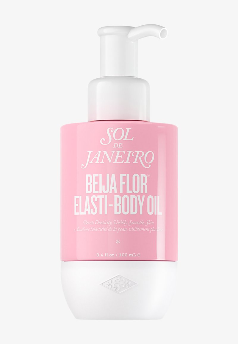 Pink og hvid pumpeflaske med Sol de Janeiro Beija Flor Elasti-Body Oil, 100 ml, mærket til at øge elasticiteten og glatte huden.