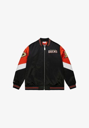 Black bomber jacket featuring red and white sleeves, "Anaheim Ducks" logo, and striped accents on cuffs and hem. Made of smooth, shiny fabric.