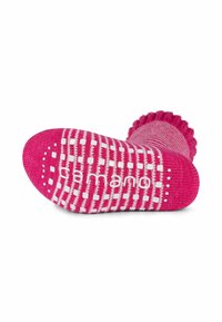 Roze cosy sok met een geribbelde bovenkant, een witte onderkant met stippen voor grip, en een gebreide textuur met het "camano"-logo op de zool.