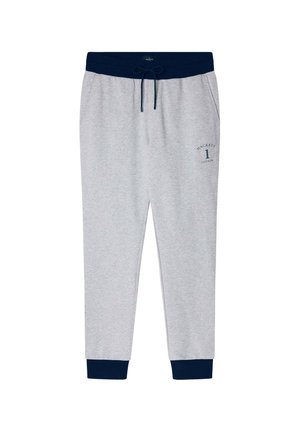 Joggers grises con una banda elástica azul marino en la cintura, cierre con cordón y tobillos ajustados. Presenta un pequeño logo azul marino en el lado izquierdo.
