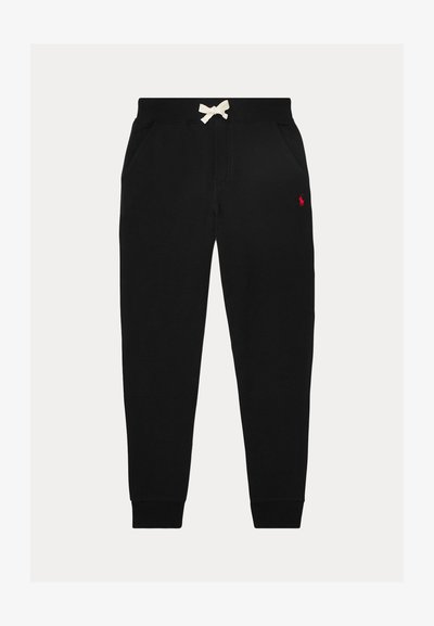 Pantalon de jogging noir avec cordon blanc, poches latérales, poignets côtelés aux chevilles et petit logo rouge sur la cuisse droite.