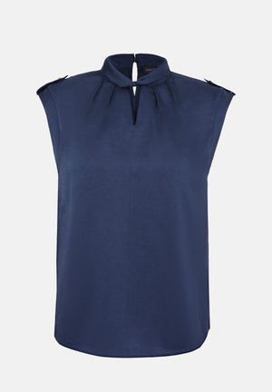Blouse bleu marine sans manches avec un col froncé, une encolure avant en forme de trou de serrure et des bretelles boutonnées aux épaules.