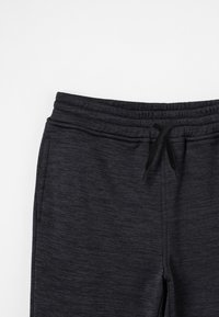 Dunkelgraue Sweatpants aus strukturiertem Stoff, mit elastischem Bund und verstellbarem Kordelzug. Verfügt über Seitentaschen und einen lässigen Schnitt.