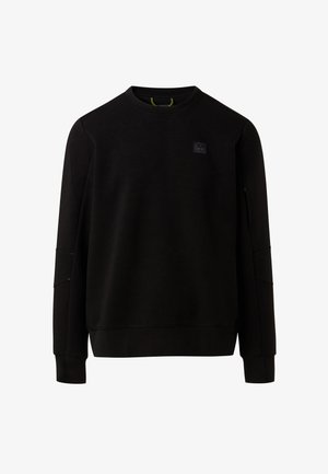 Black sweatshirt made of soft, textured fabric, featuring a round neck, long sleeves, and a small logo patch on the chest.
