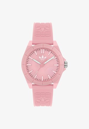 Pink silikoneur med rund urskive, tekstureret rem og sølvfarvede visere. Har et bølgemønster på urskiven og Adidas-logo på remmen.