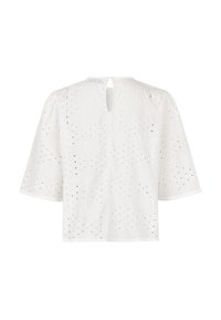Chemisier en coton blanc avec un motif texturé et des découpes, manches courtes bouffantes et une ouverture en goutte dans le dos.
