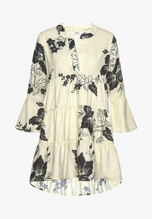 Roomwitte jurk met zwarte bloemenprint, gelaagde rok, klokmouwen en een V-hals met een korte kraag.