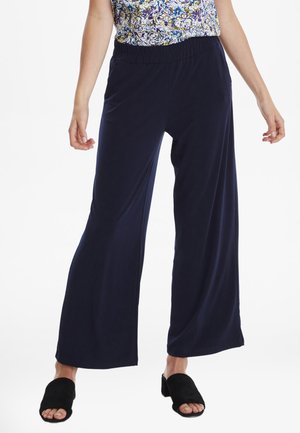 Marineblauwe wijde broek van zacht materiaal met een elastische tailleband, met een gladde textuur en een ontspannen pasvorm.