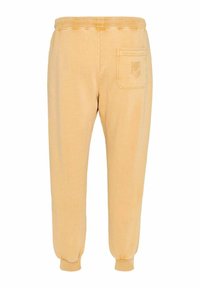 Pantalon de survêtement jaune avec une taille côtelée, des poignets élastiques et une poche arrière unique avec un détail de logo brodé.
