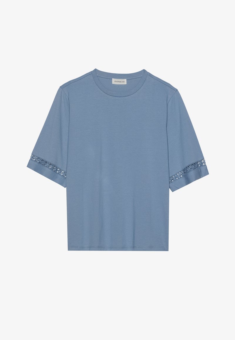 Light blue short-sleeve t-shirt with lace detail on cuffs, soft fabric, crew neck, relaxed fit, and no visible logos or patterns.