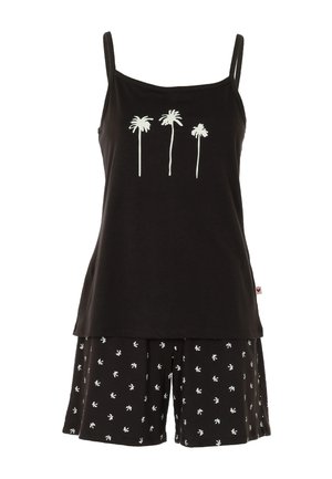 Top nero senza maniche con tre stampe bianche di palme abbinato a pantaloncini neri con piccoli motivi di palme bianche.