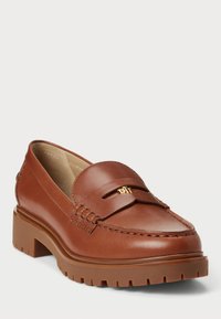 Brown leather loafers with a round toe and thick, chunky sole. Features a decorative band and a gold-tone logo accent on the vamp.