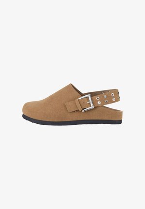 Brown suede slip-on clogs with a buckle strap and decorative silver studs, featuring a textured surface and a black rubber sole.