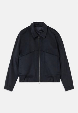 Dark navy jacket with a collared neck, front zipper, and elastic cuffs. Features two side pockets and a smooth, textured design.
