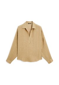 Camicia beige a maniche lunghe con un design testurizzato e a coste. Presenta un colletto, una patta con bottoni e una vestibilità rilassata. L'orlo è leggermente curvato.