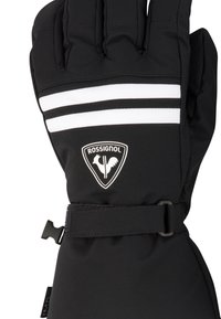 Guanti da neve neri con strisce bianche e una patch con logo. Realizzati in tessuto morbido, includono una cinghia fissata per una vestibilità aderente.