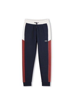 Pantalon de jogging bleu marine avec taille blanche, panneaux latéraux rouges, cordon noir, chevilles resserrées et logo "BOSS" sur la cuisse droite.