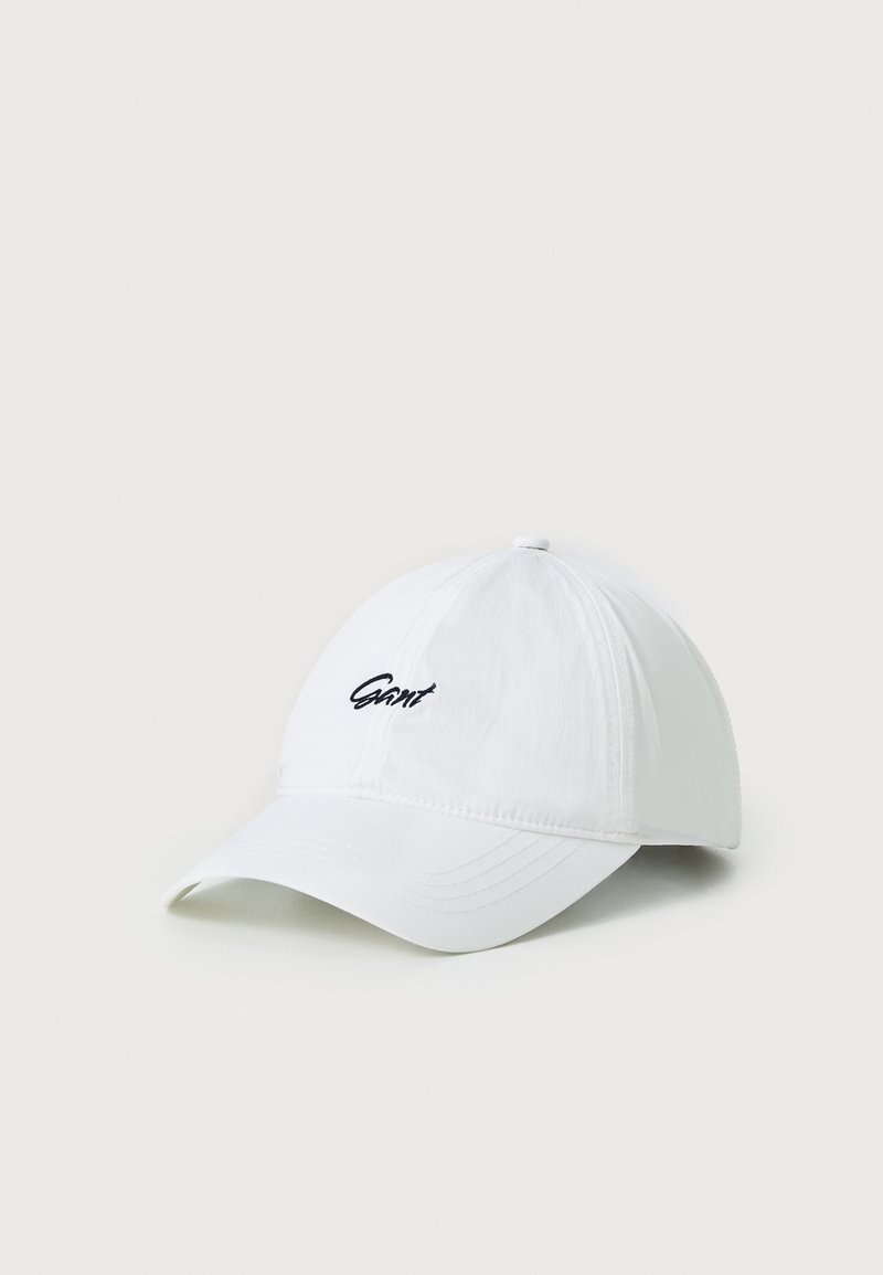 White baseball cap made of fabric, featuring a curved brim and embroidered black logo on the front. Lightweight and casual design.