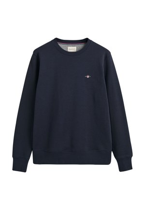 Navy sweatshirt made of cotton blend, featuring a ribbed crew neckline, long sleeves, and a small embroidered logo on the chest.