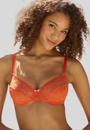Lace bra in bright orange featuring structured cups, adjustable straps, and a small pink accent detail at the center. Smooth texture.