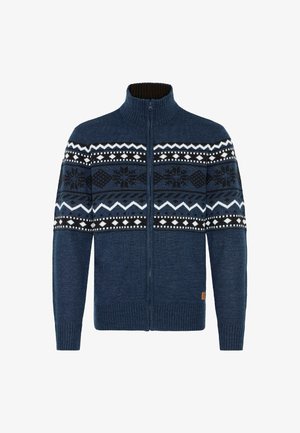 Dzianinowy sweter na zamek w kolorze granatowym z kremowymi i czarnymi geometrycznymi wzorami. Posiada wysoki kołnierz oraz prążkowane mankiety i dolny brzeg.