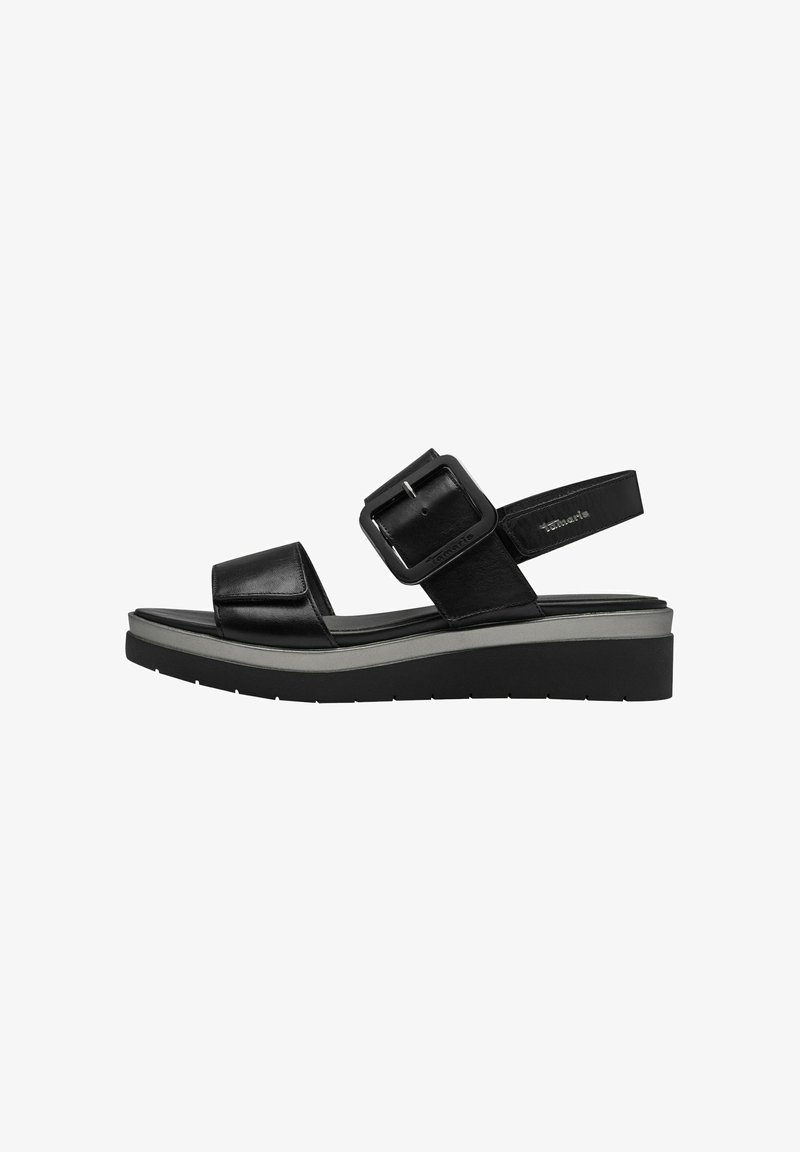 Black leather platform sandals with a wide strap and adjustable buckle. Features a contoured footbed and textured rubber sole.