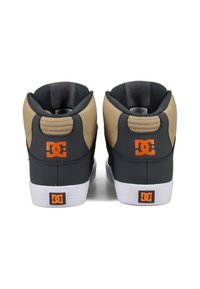 High-top sneakers featuring a black leather body, beige accent panels, textured back, and orange logo, with a white rubber sole.