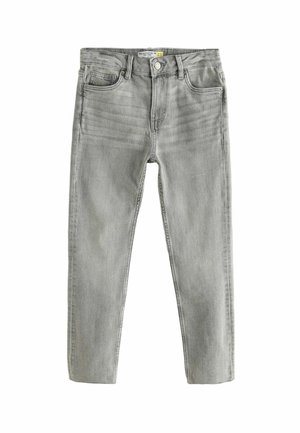 Jean slim gris clair avec poches avant, passants de ceinture, fermeture par boutons, et détails subtilement délavés.