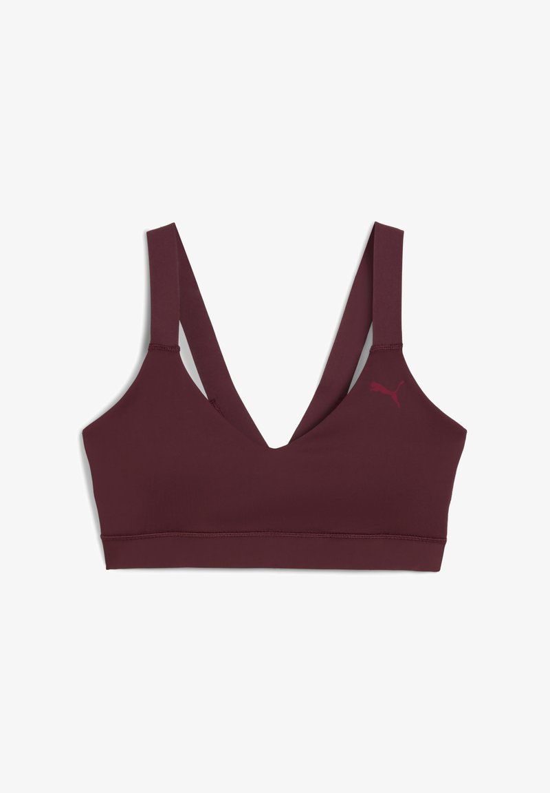Kestenjasti sportski bralette s V-izrezom, širokim naramenicama i malim logom. Izrađen od glatkog, elastičnog materijala za udobnost.