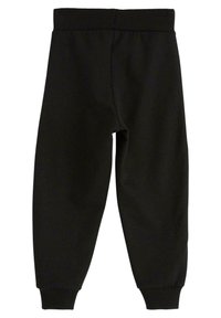 Schwarze Jogginghosen aus weichem Stoff, mit einem Bund und engen Manschetten an den Knöcheln, mit glatter Textur und ohne sichtbare Muster.