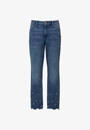 Blaue Denim-Jeans mit geraden Beinen, ausgefransten Säumen und verstreuten dekorativen Perlen nahe dem unteren Ende jedes Beins.