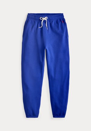 Modre flisne trenirke z elastičnim pasom, belim vrvico za zategovanje, stranskimi žepi in elastičnimi manšetami, položene ravno na belem ozadju.