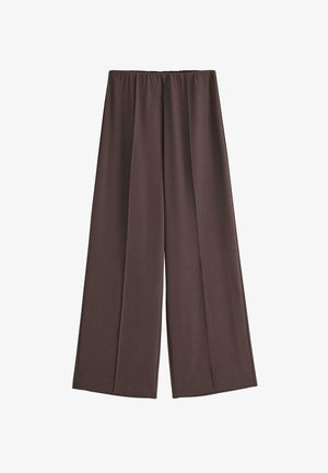 Bruna vida byxor i mjukt tyg, med elastisk midja och två framfållar för extra designdetaljer.