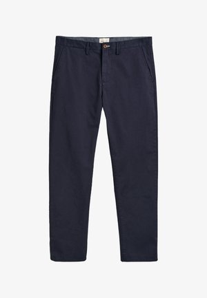 Tengerészkék pamut chino egyenes szárú kialakítással, gombos záródással és övhurkokkal. Sima textúra és minimális varrási részletek.