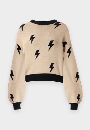 Beige cropped sweater med sorte lynmønstre, brede ærmer og sort ribkant ved hals og manchetter. Blød strikket tekstur.