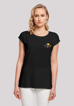 Black short-sleeve t-shirt featuring a colorful turtle graphic on the chest. The fabric appears soft with a relaxed fit.