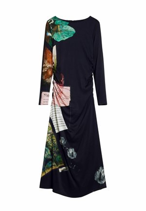 Long-sleeve black dress features vibrant floral and text prints, textured fabric, and gathered detailing on one side, creating a dynamic look.