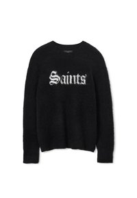 Czarny, puszysty sweter z długim rękawem z białym napisem w stylu Old English "Saints" z przodu, okrągłym dekoltem oraz prążkowanymi mankietami i dołem.