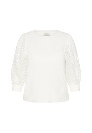 Bela majica s kratkimi, napihnjenimi rokavi iz čipke. Okrogla izrez in enobarven del, z teksturiranimi vzorci čipke na rokavih.