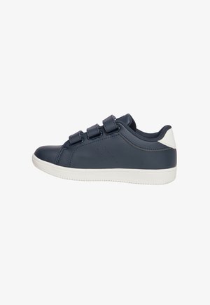 Navy blue sneaker with velcro straps, smooth leather upper, white rubber sole, and perforated details for breathability.