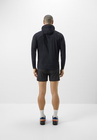 Klättermusen HOODED JACKET  - Softshell-jope - black