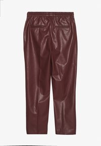 Burgundy faux leather pants with an elastic waistband, featuring two back pockets and a smooth, shiny texture.