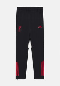 Sorte treningsbukser med røde Adidas-striper og Liverpool FC-logo. Har to sidelommer og elastisk liv med glidelåser ved ankler.
